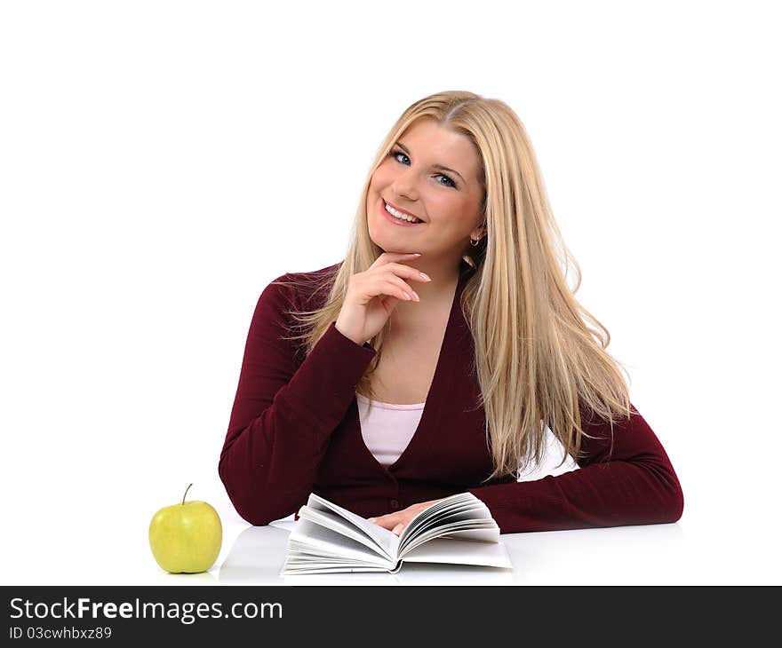 Pretty casual female with green apple reading book. isolated