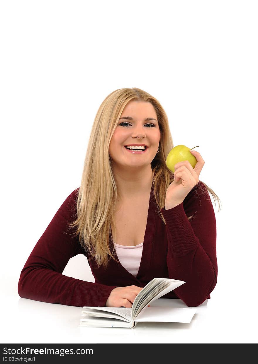 Pretty casual female with green apple reading book. isolated