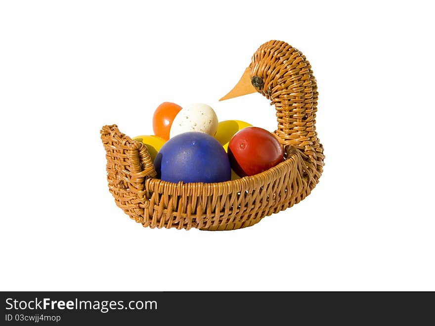 Isolated color Easter eggs in basket on white background