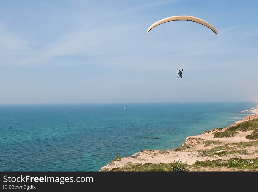 Parachute flying above the sea . Israel . Parachute flying above the sea . Israel .