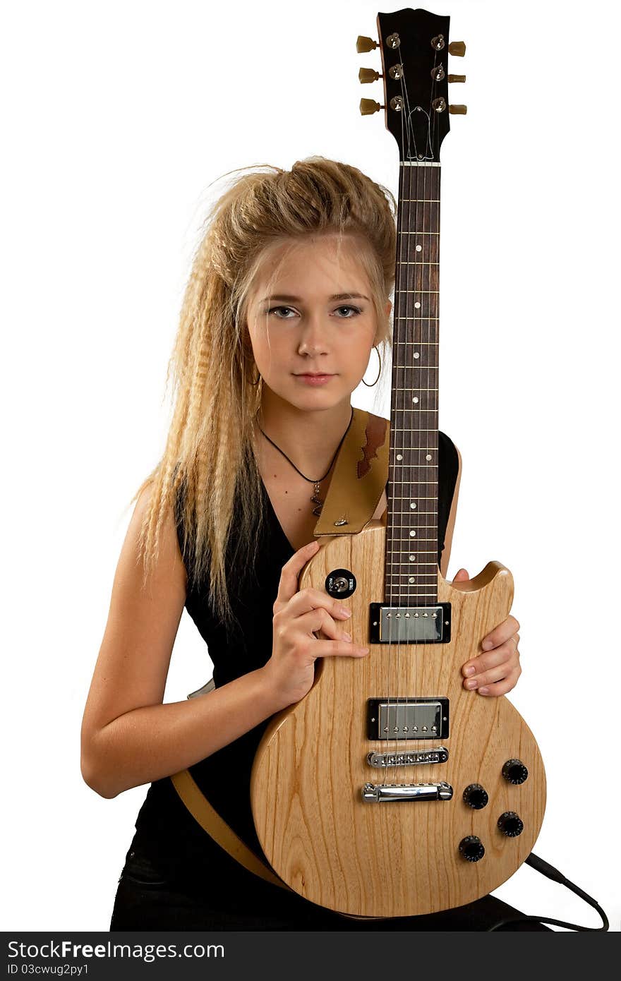 Blond rock teenage girl with an electric guitar. Studio shot, isolated on white background. Blond rock teenage girl with an electric guitar. Studio shot, isolated on white background.