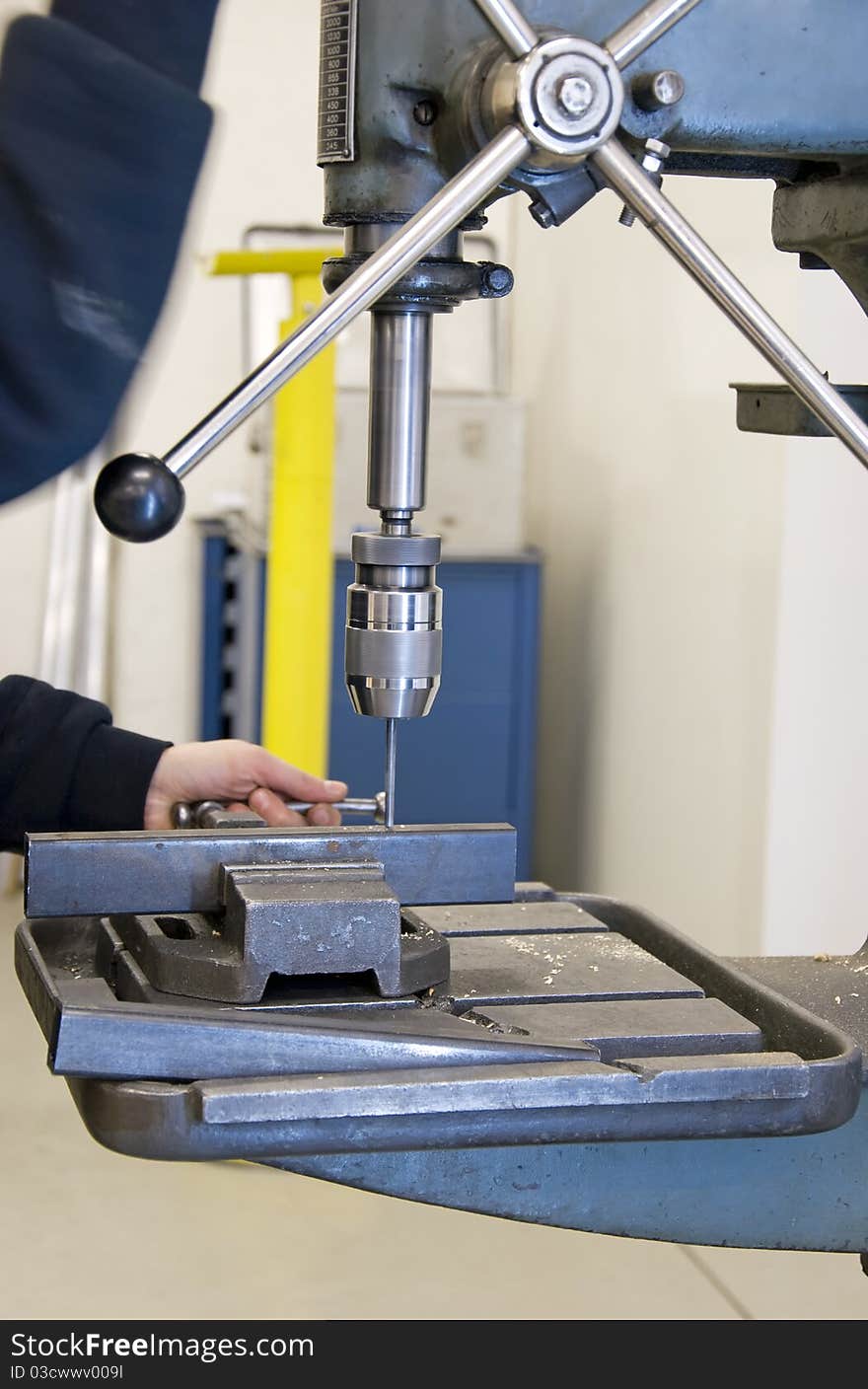 Metal worker with drilling tool and work piece