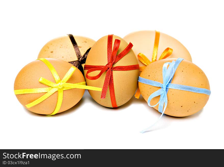 Easter eggs with different ribbons and bows, isolated on white. Easter eggs with different ribbons and bows, isolated on white