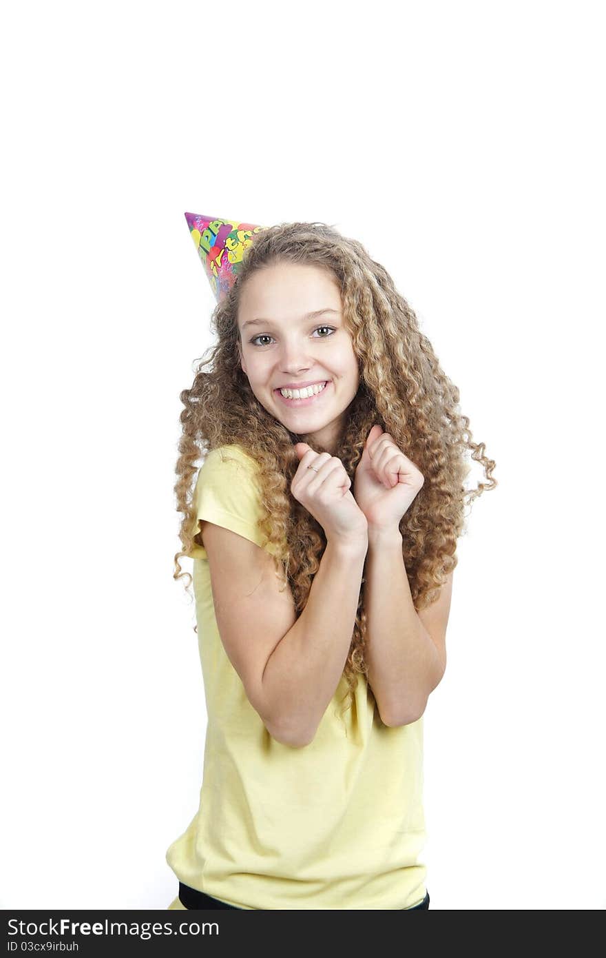 Smiling woman in birthday hat over white