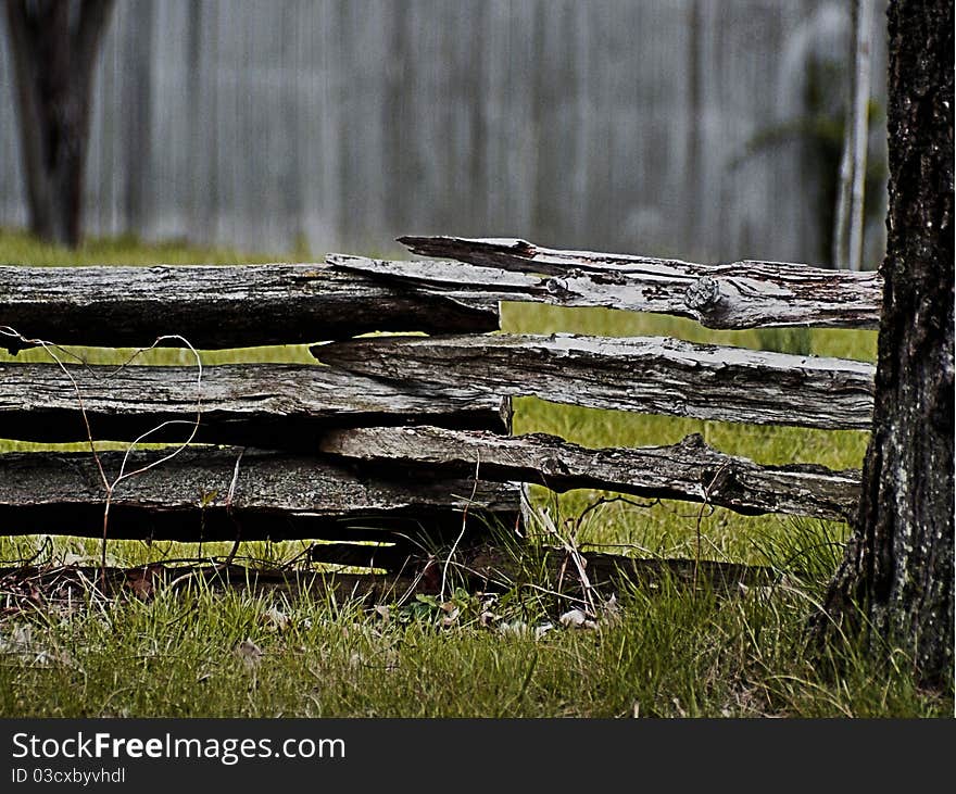 Phtograph of a split rail fence, aged wood with beautiful texture