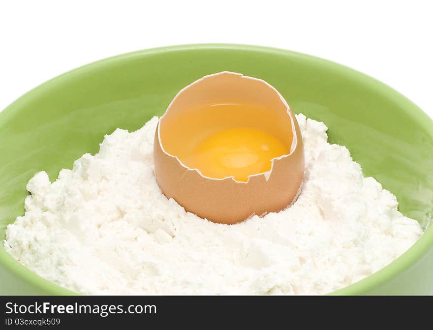 An egg is in a flour