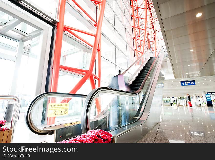 People At The Airport Escalator