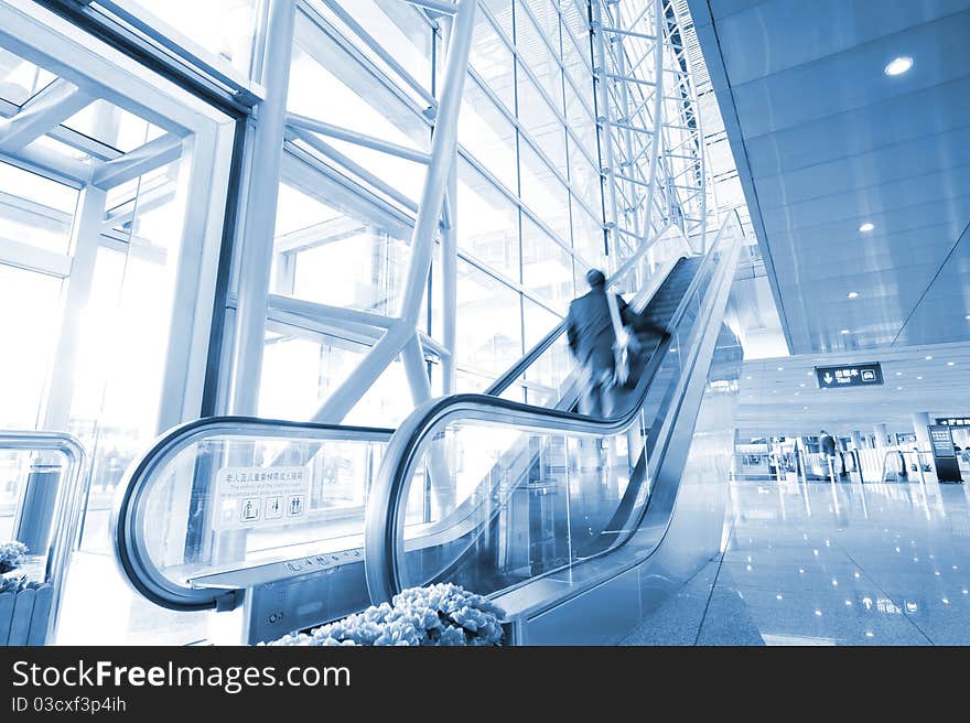 People At The Airport Escalator