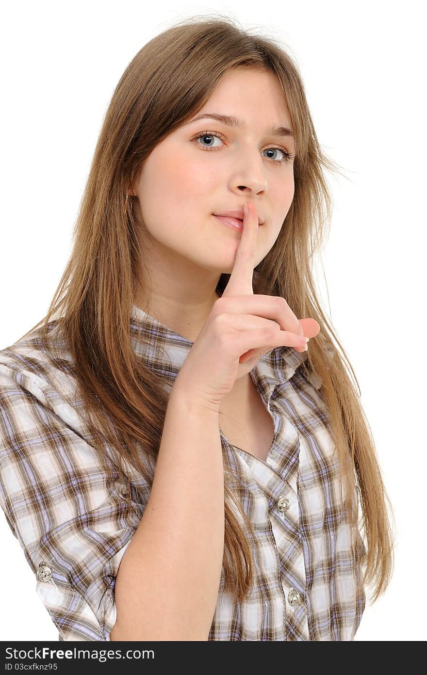 Young woman says ssshhh to maintain silence on a white background