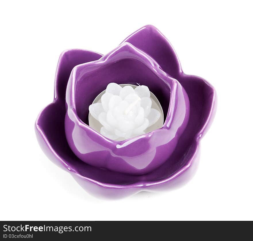 Candle in the form of porcelain violet isolated on a white background