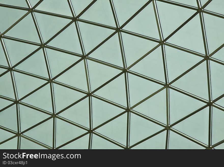 Detail of a piece of glass with metal inserts triangular. Detail of a piece of glass with metal inserts triangular