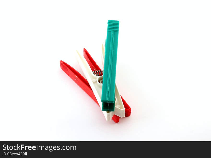 Three plastic clips, depicting the Italian flag colors. Three plastic clips, depicting the Italian flag colors