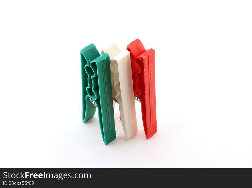 Three plastic clips, depicting the Italian flag colors. Three plastic clips, depicting the Italian flag colors