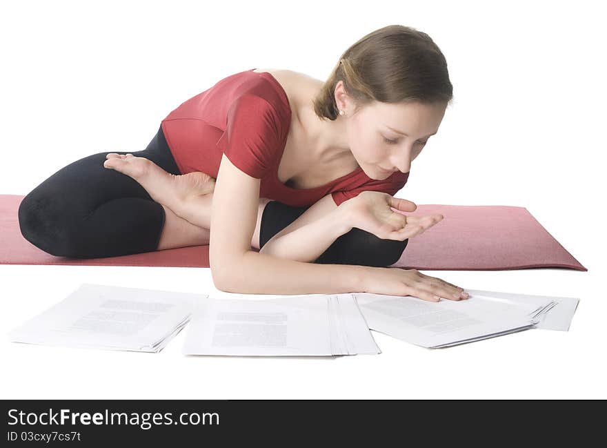 Young woman in sports clothes working with documents. Young woman in sports clothes working with documents