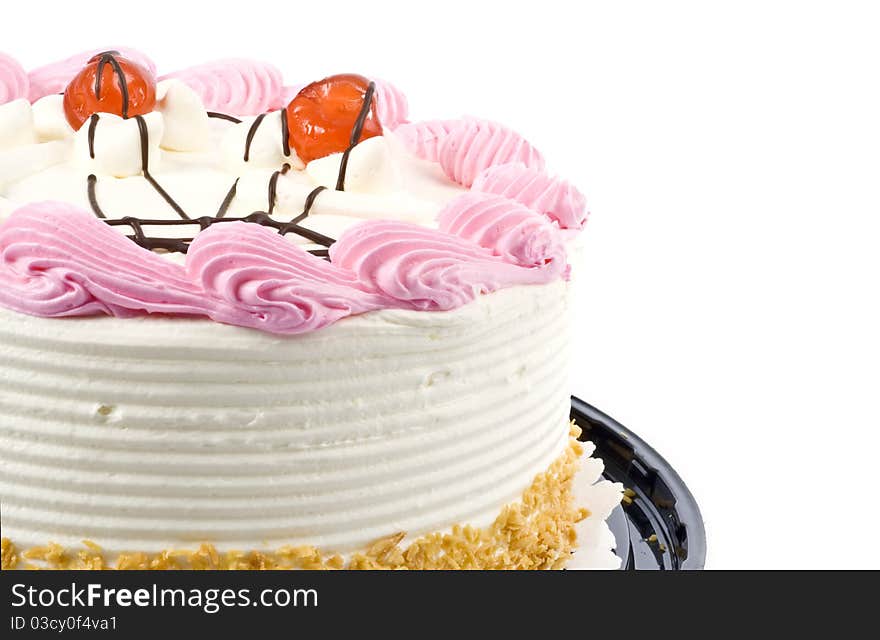 A white and pink birthday cake decorated with cherries. A white and pink birthday cake decorated with cherries.