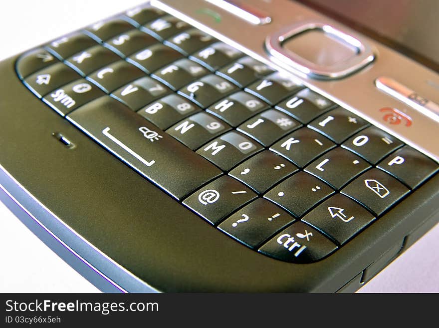 Image shows mobile phone keyboard close-up