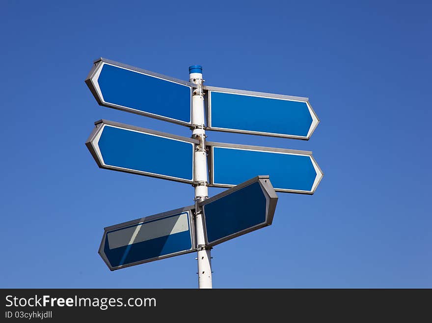 A sign with blue sky