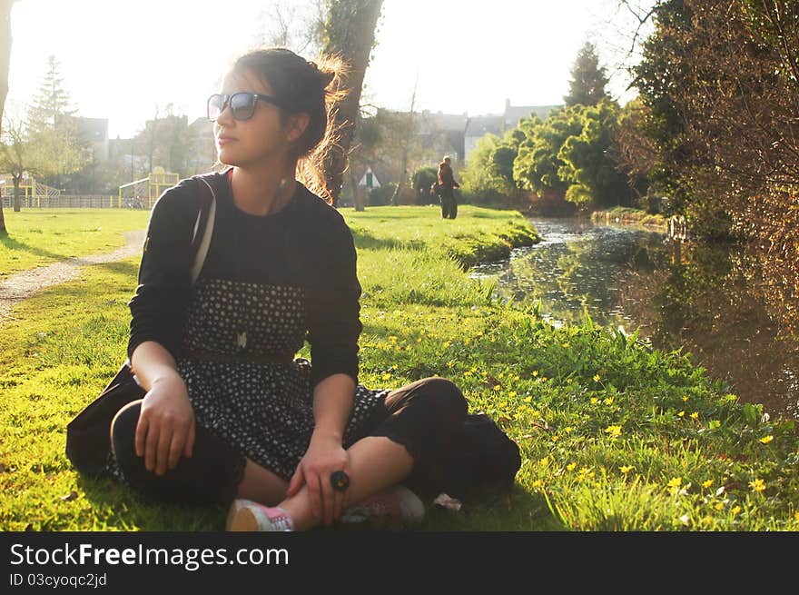 Young girl on the spring green grass. Young girl on the spring green grass