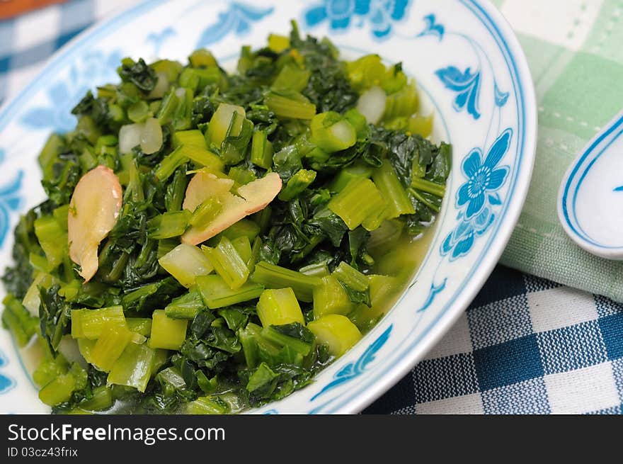 Healthy and simple stir fried green vegetables in Oriental kitchenware. Healthy and simple stir fried green vegetables in Oriental kitchenware.