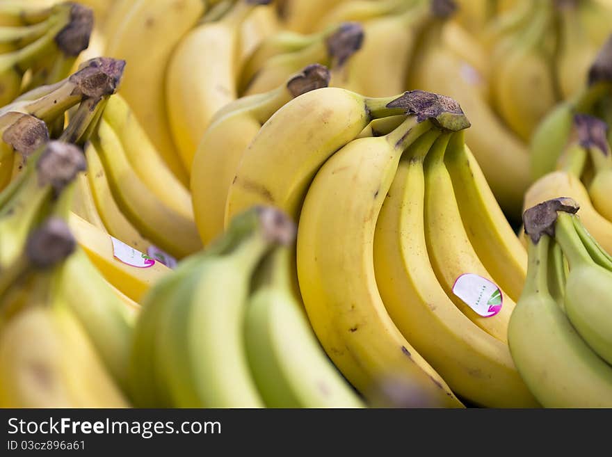 Close up on a bunch of bananas for sale on a street market's table.