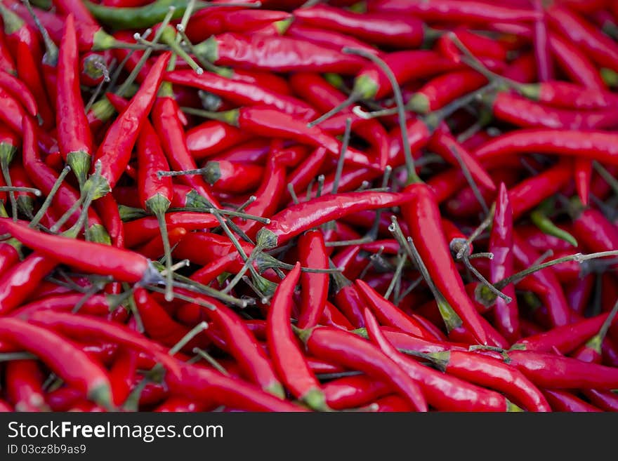 Spicy Hot Red Peppers on a street market table.