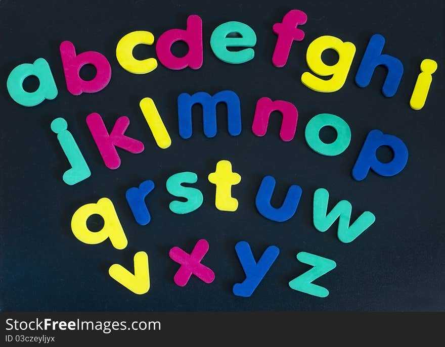 Made of colorful rubber letters on the dark background. Made of colorful rubber letters on the dark background