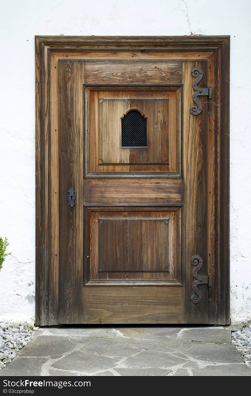 Light old door with metal handle in Germani. Light old door with metal handle in Germani