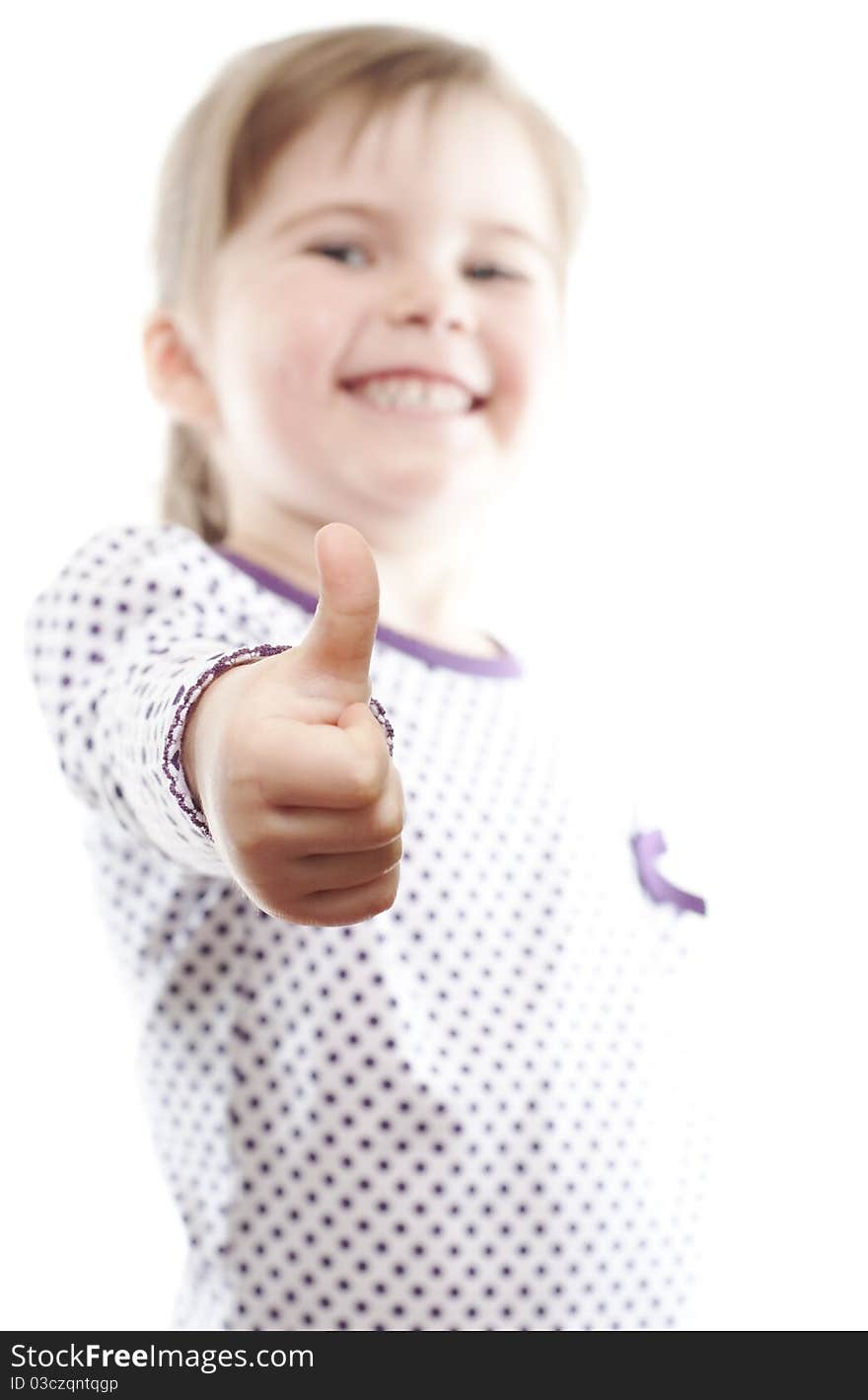 Little girl showing thumb up on white