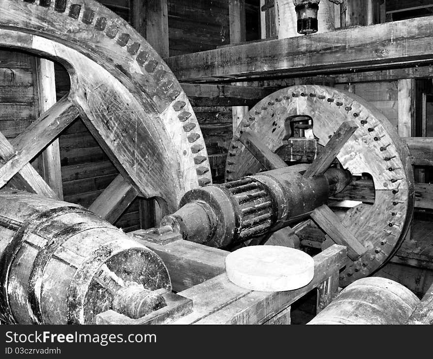 Black white of a watermill inside