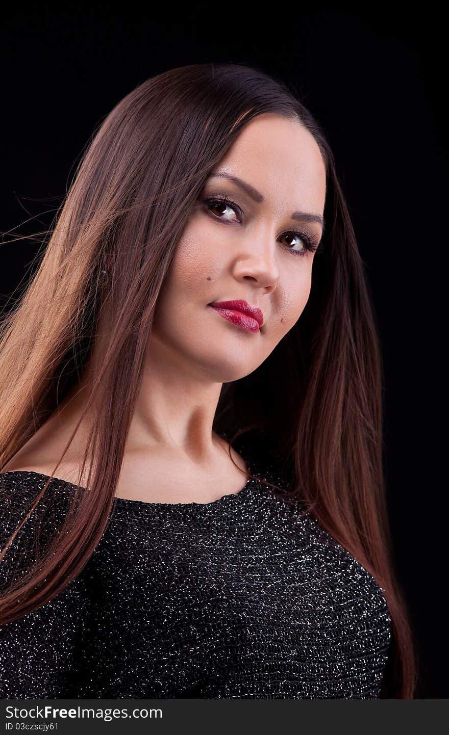 Woman with long hair in dark cloth