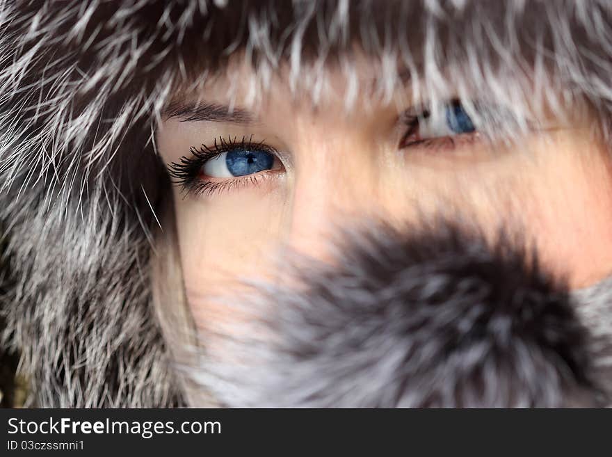 Beautiful woman in winter fur coat