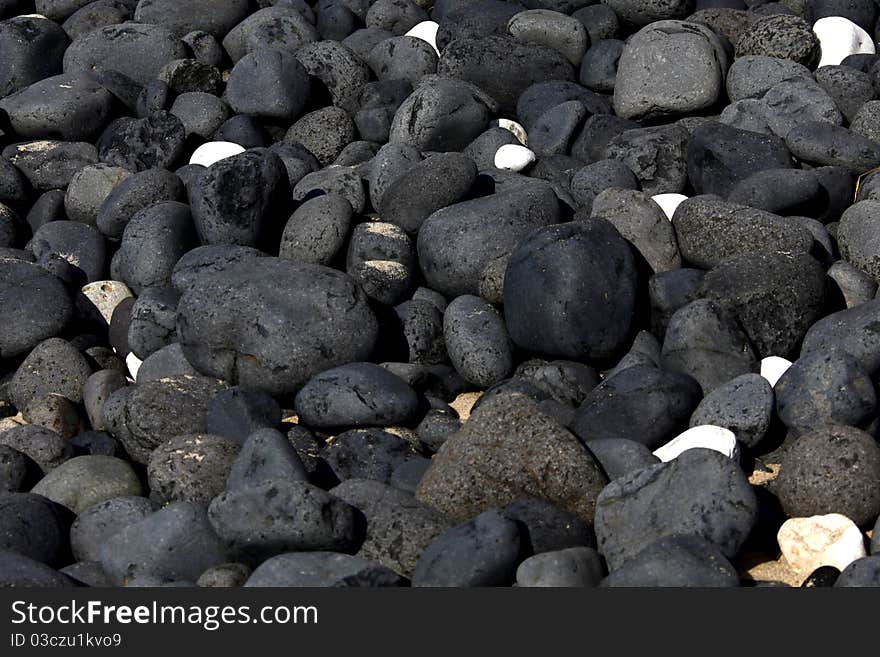 One White Stone Standing Out Among Gray Ones