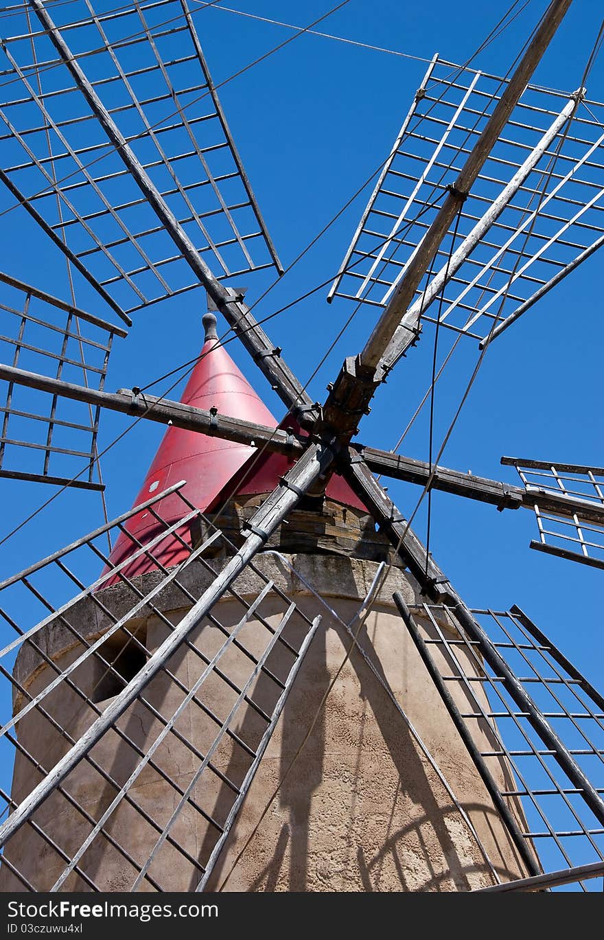 Ancient windmill located close to the saline in trapani. Ancient windmill located close to the saline in trapani