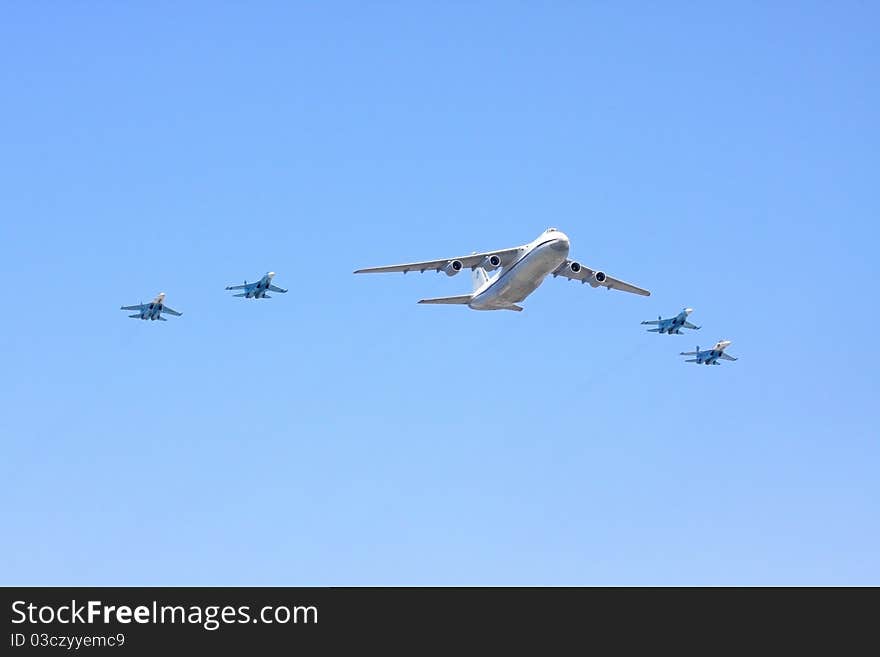 The transport plane accompanied by fighters on parade of the Victory over Moscow