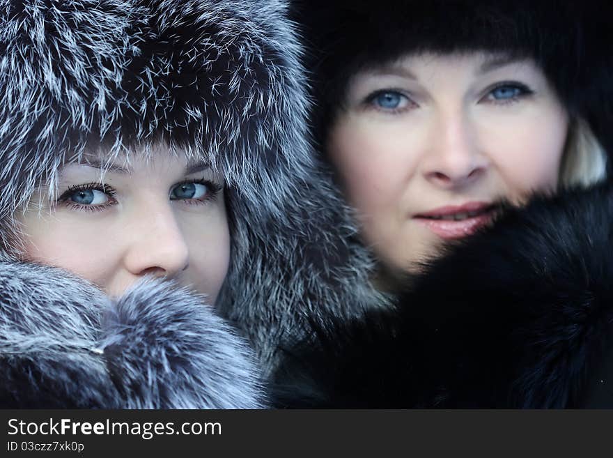 Beautiful woman in winter fur coat