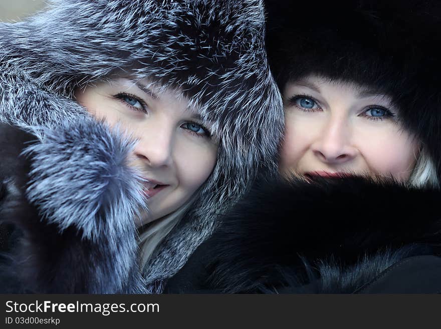 Beautiful woman in winter fur coat