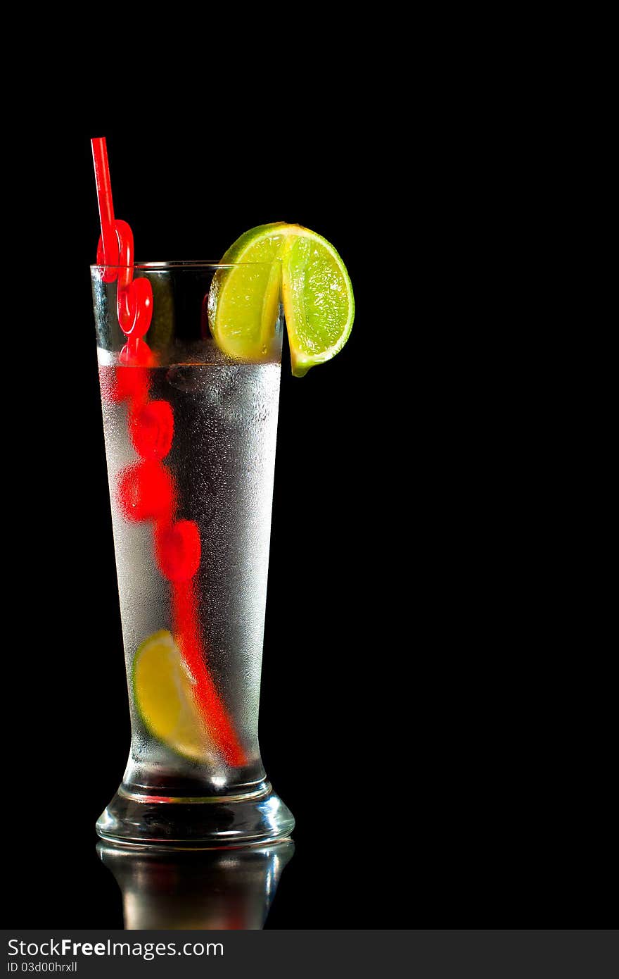 Drink With Fresh Lime And Red Straw