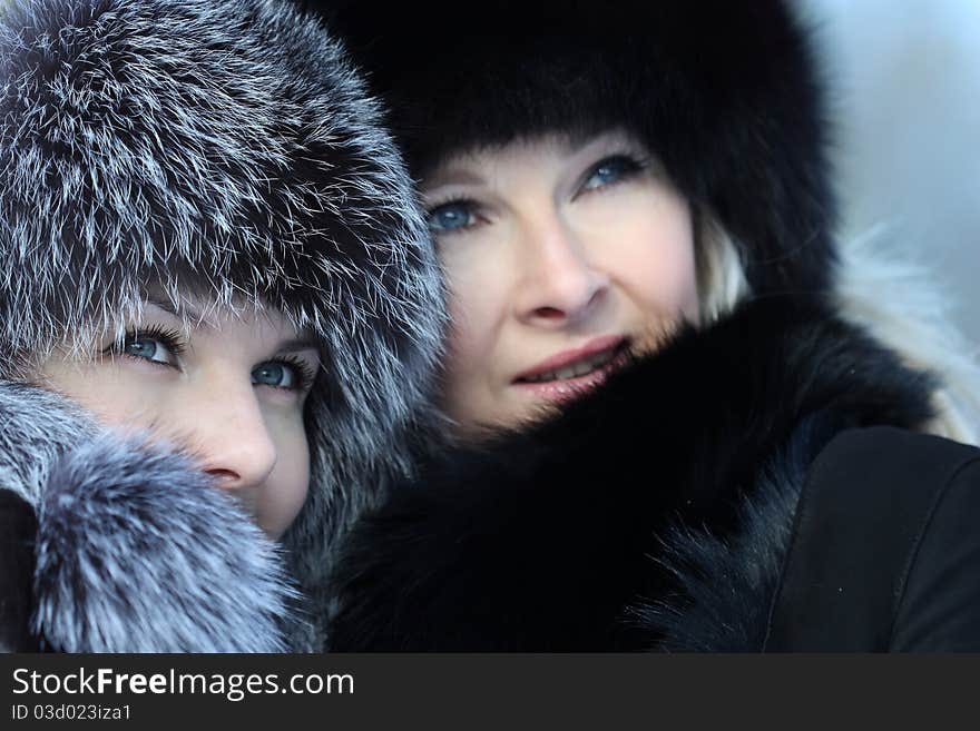 Beautiful woman in winter fur coat