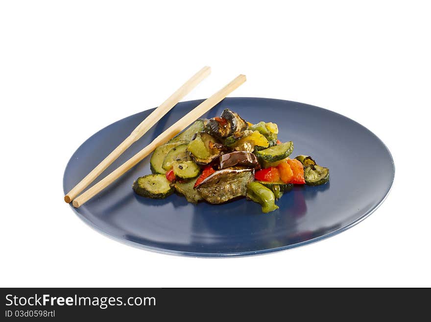 Chopsticks and mixed grilled vegetables