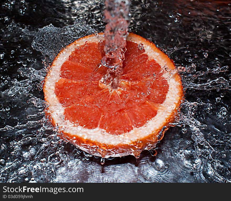 Water splashing over an oranges. Water splashing over an oranges