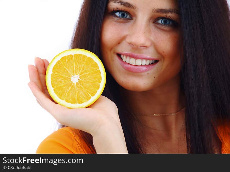 Orange in woman hands close up