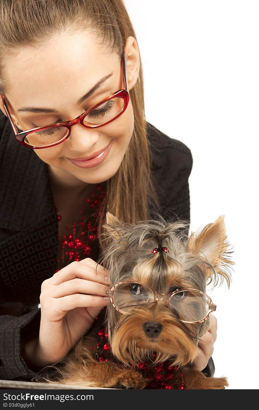 The young elegant woman with Yorkshire Terrier isolated on a white background