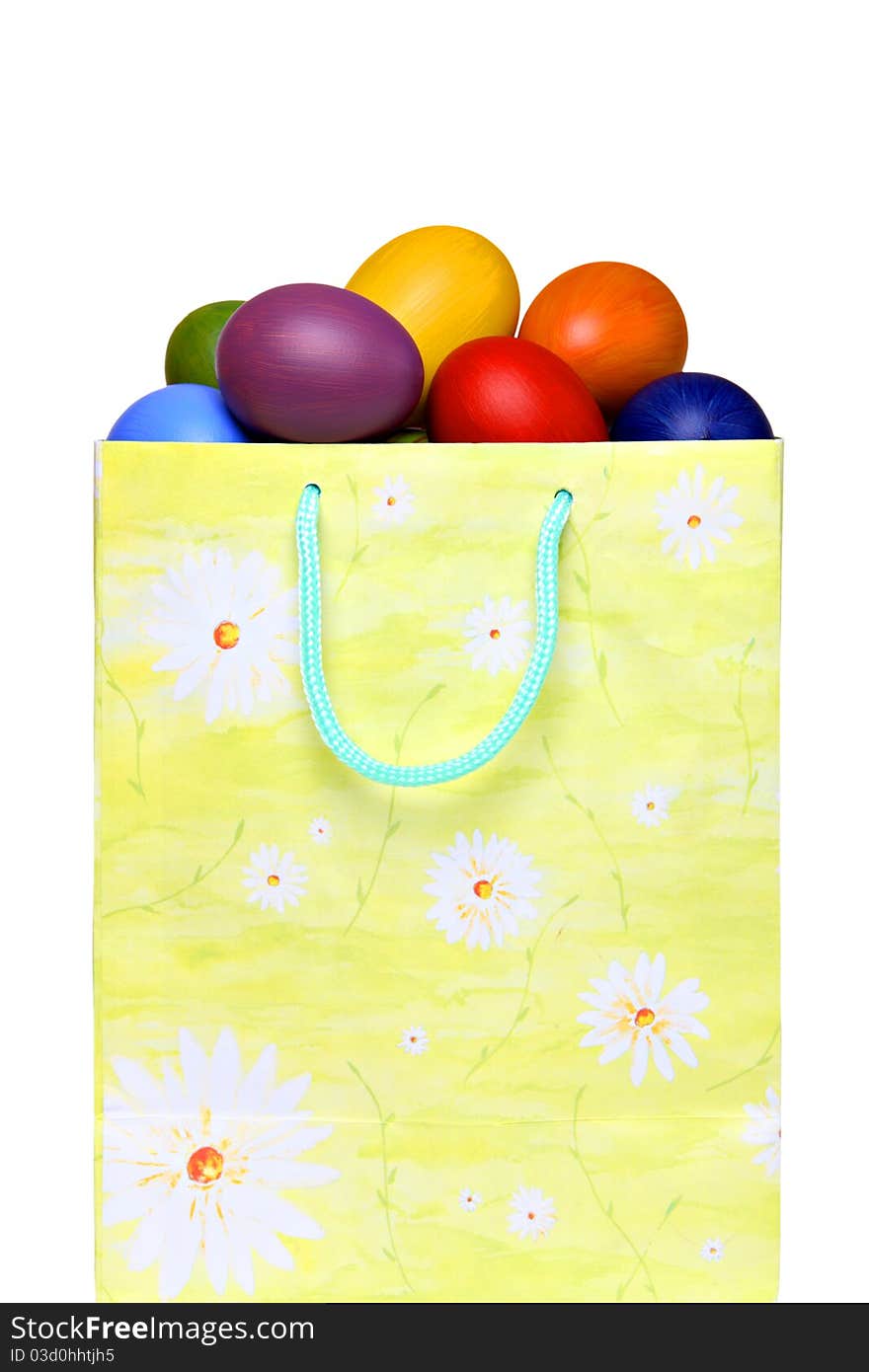 Colorful Easter eggs in gift bag, isolated on white