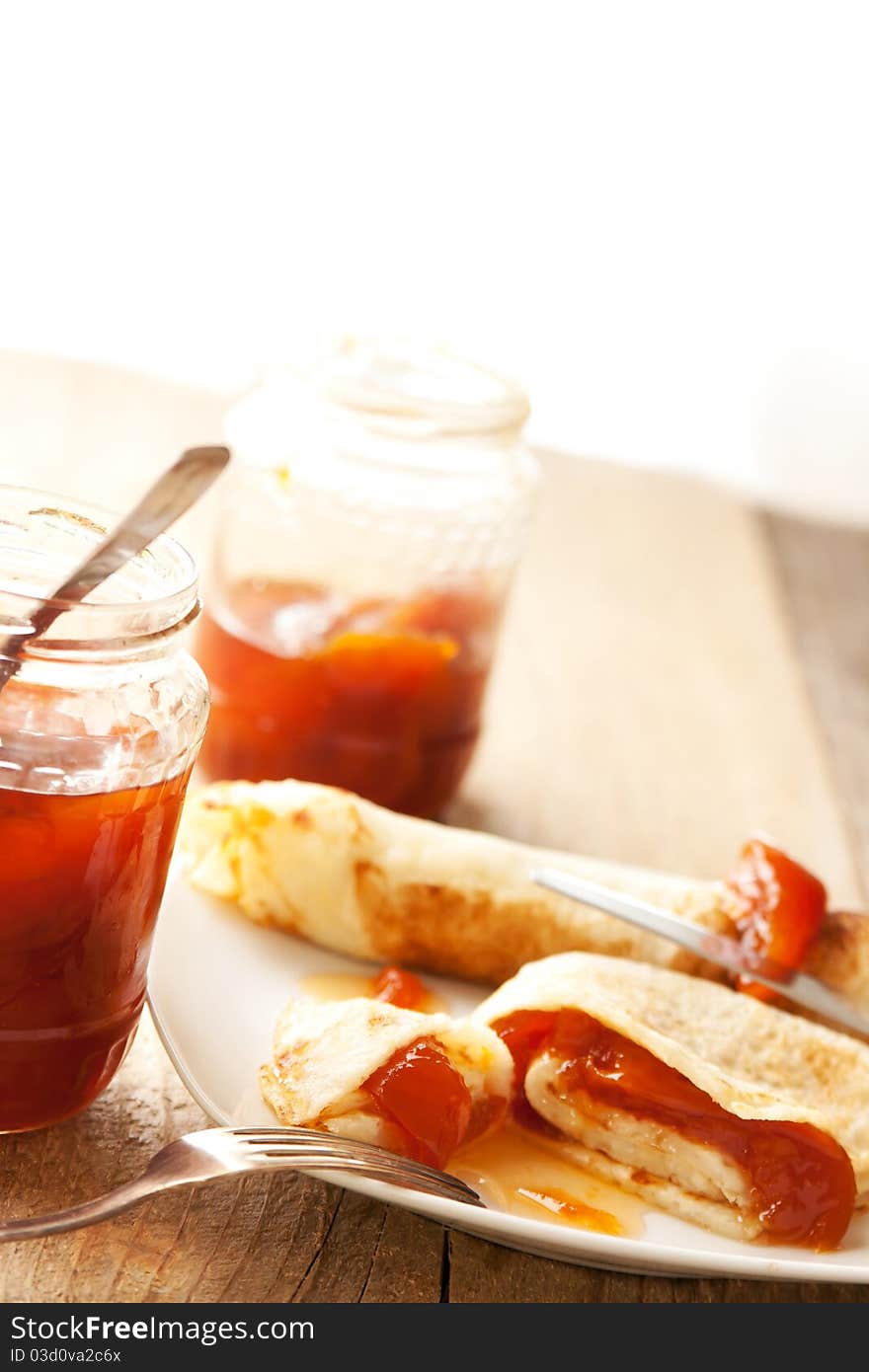 Pancakes with peaches jam filling