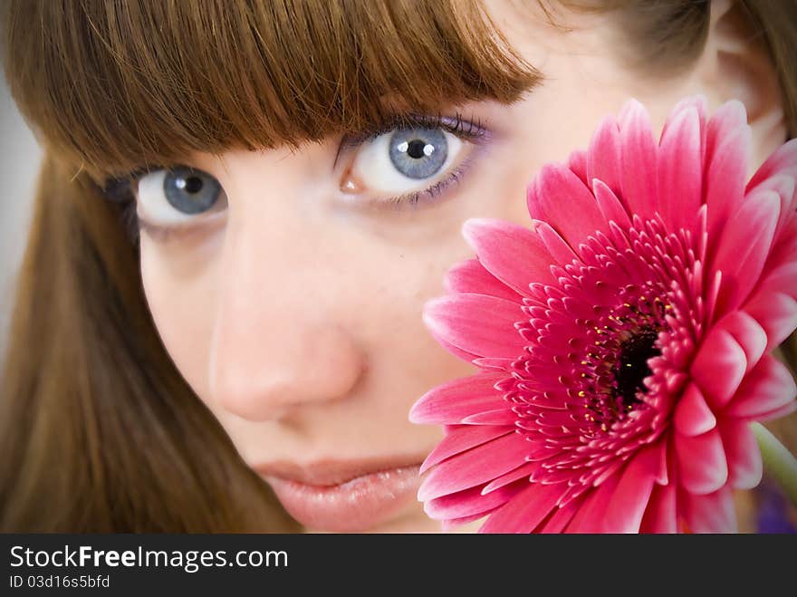 Portrait of a beautiful woman with a flower