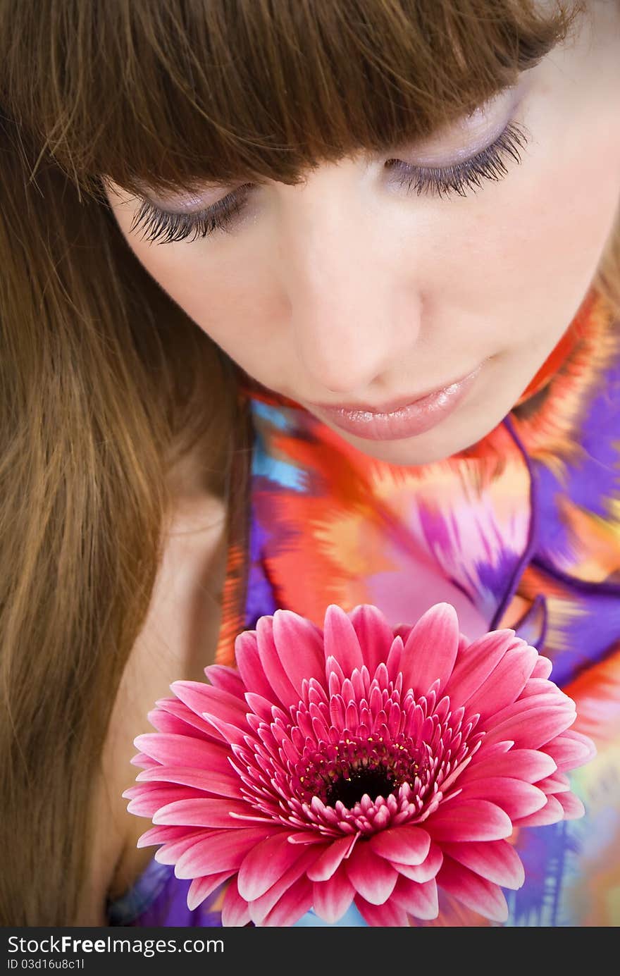 Portrait of a beautiful woman with a flower