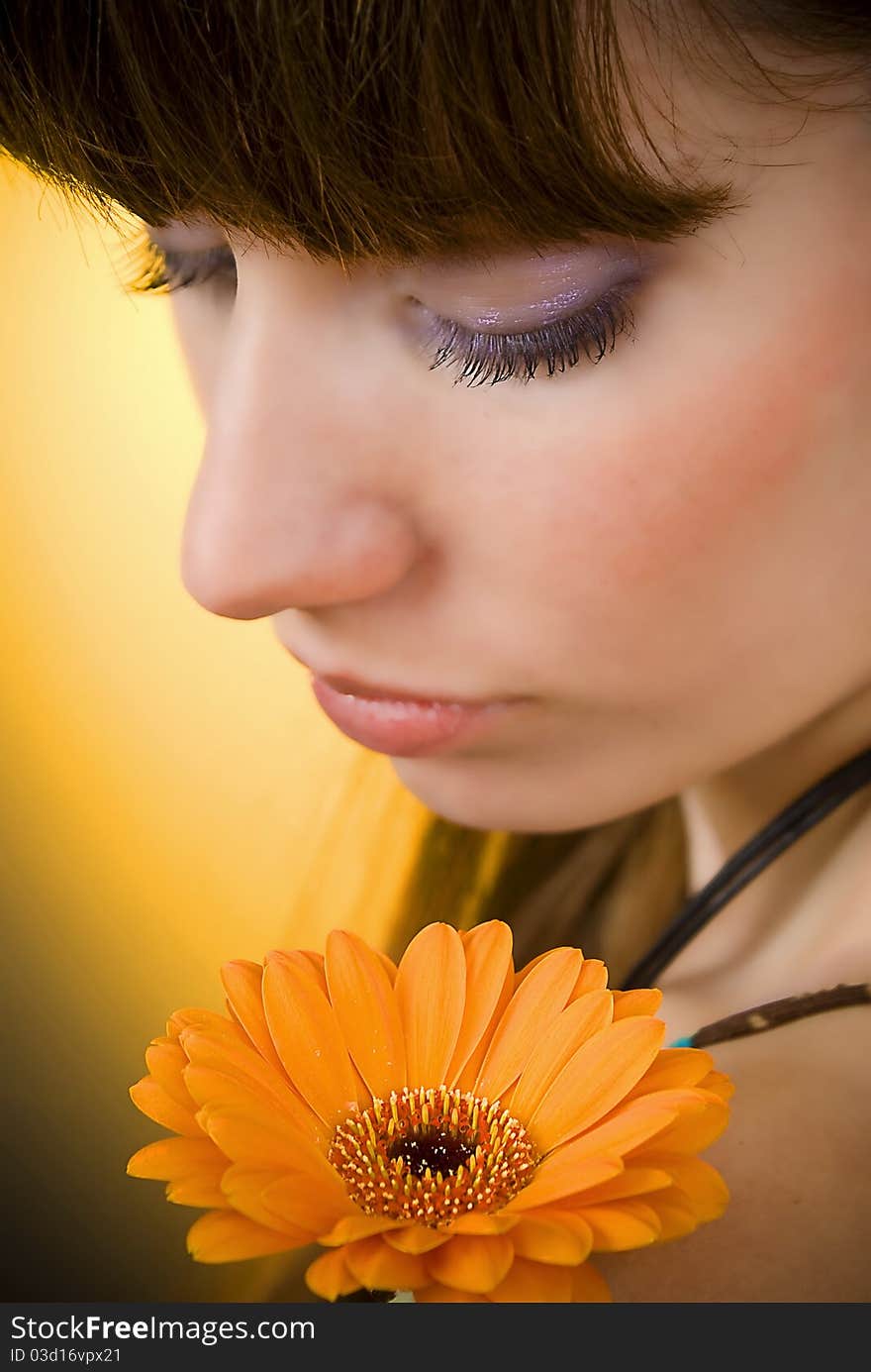 Portrait of a beautiful woman with a flower