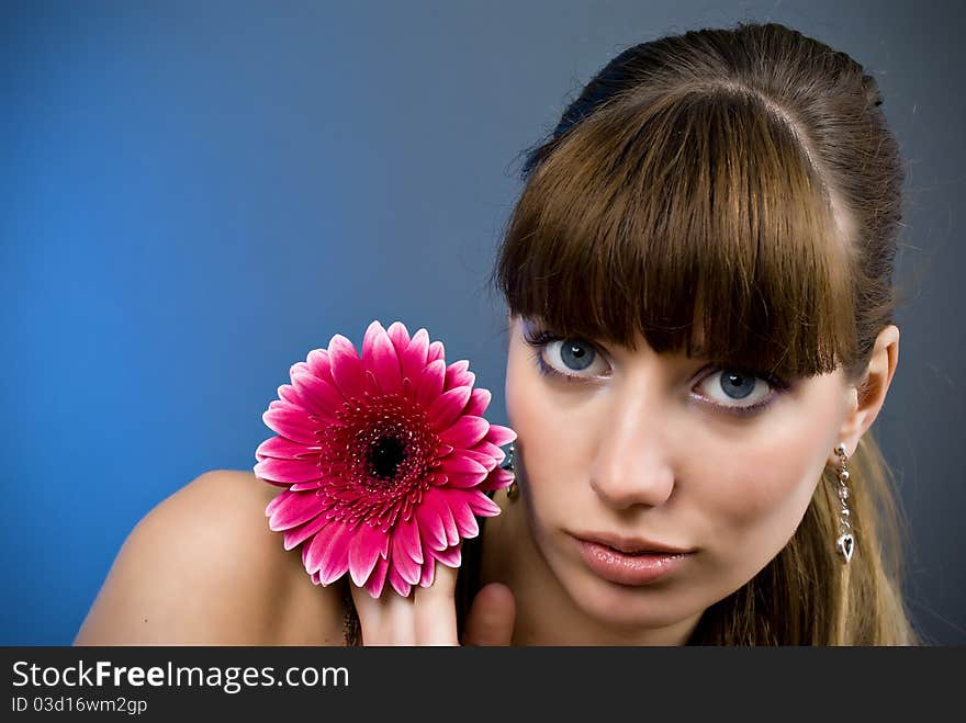 Portrait of a beautiful woman with a flower