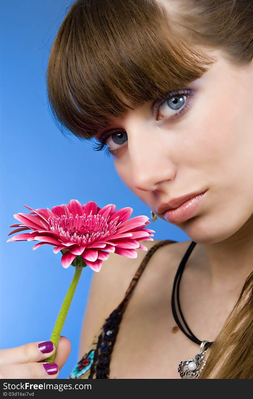 Portrait of a beautiful woman with a flower