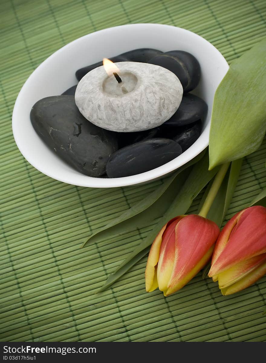 Spring zen like SPA with red tulips and candle